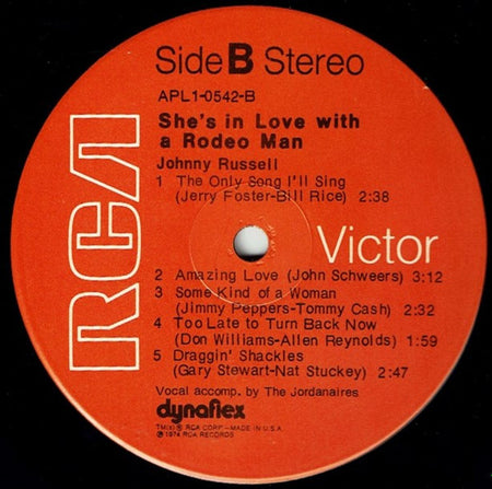 Johnny Russell (2) : She's In Love With A Rodeo Man (LP, Album)